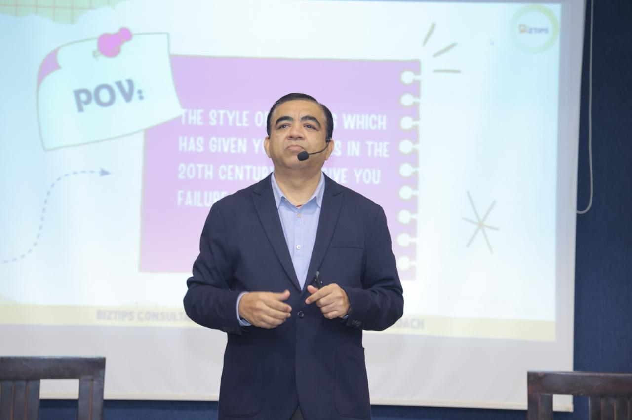 Coach delivering the Scale Your Business workshop on stage
